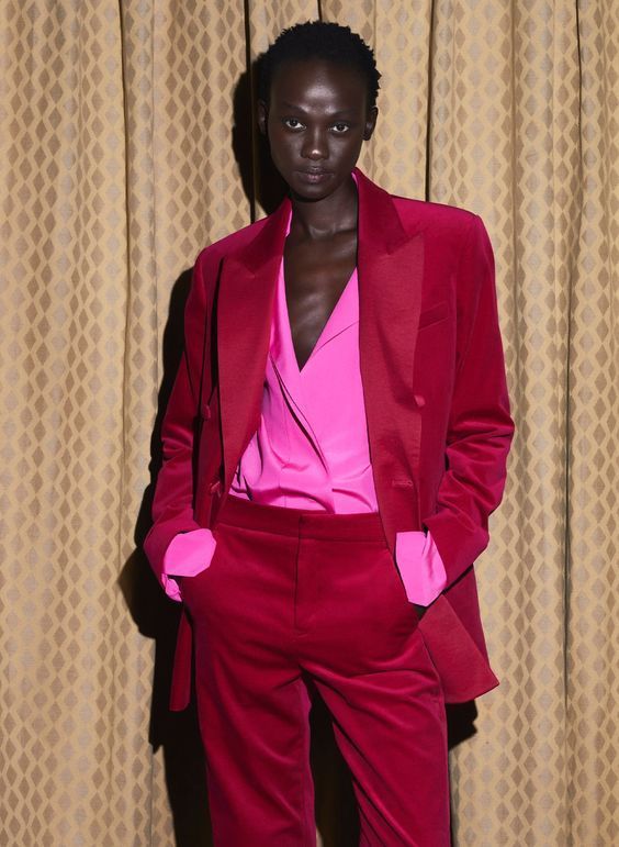 Model wearing power suit in the pantone color of the year - viva magenta - lifestyle heir