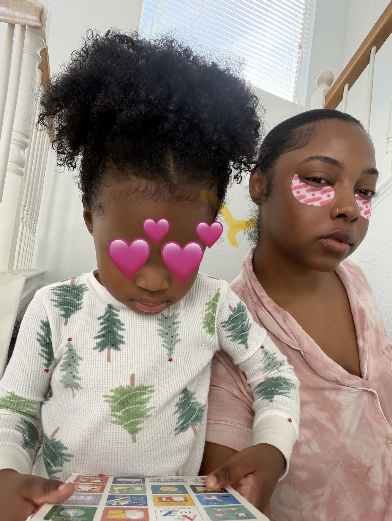 Morgan Ashley and her daughter reading together at home in matching Christmas pajamas - Raising children by Birth Chart 