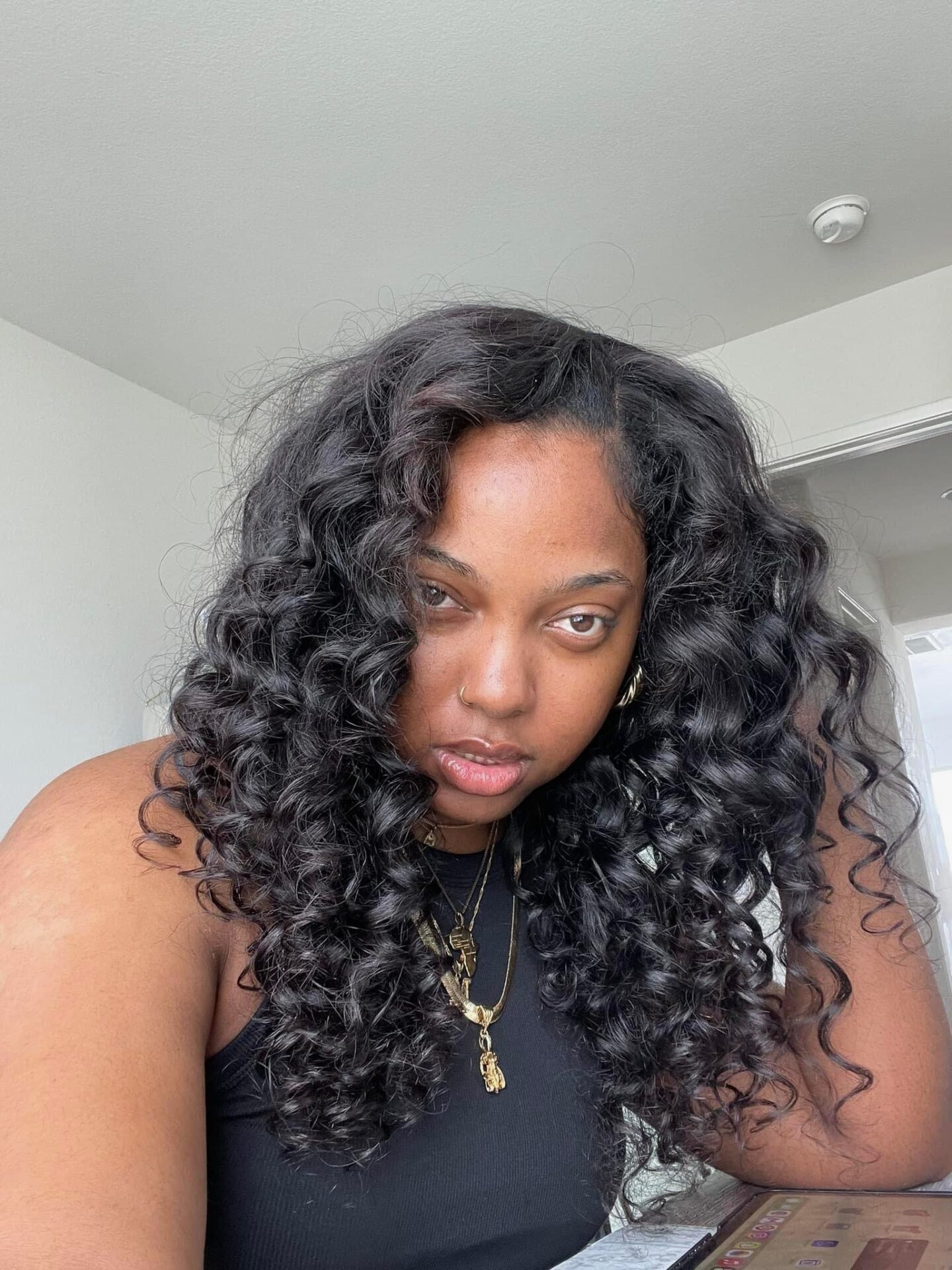 Morgan Ashley &mdash; natural skin, curly hair, gold jewelry, direct gaze &mdash; skincare for melanin-rich skin over 40